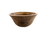 Vintage African wooden bowl with a rustic, hand-carved faceted exterior.