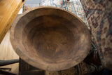 The hand-carved interior of a vintage wooden bowl showing rich wood grain and natural character.