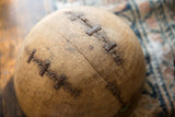 Close-up of vintage Tuareg wooden bowl with distinctive metal repairs.