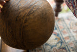 Side view of the vintage wooden bowl, highlighting its aged patina and carved line details.