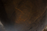 Rich patina and time-worn texture on the interior of the vintage wooden bowl.