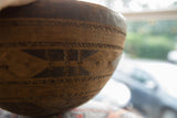 Vintage African wooden bowl, deep brown with hand-carved zigzag and etched patterns.