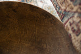 Aged dark brown wood interior of vintage African bowl, with textured grain and minor cracks.