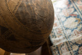 Etched geometric patterns and natural wood patina on the vintage African bowl.