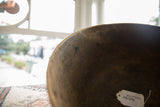 Close view of the rich, dark patina and aged texture on the vintage wooden bowl.
