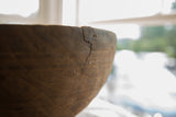 Unique metal staple repairs mending a crack on the vintage African wooden bowl.