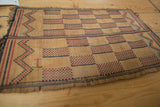 Vintage African Tuareg mat, handwoven with red, black, blue zigzag border.