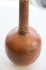 Detailed view of the handmade ribbed neck on the aged red slip ware vase.