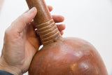 Detail of the incised rings and rustic texture on an antique North African vase neck.