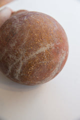 Storied, textured surface detail on the antique North African slip ware.