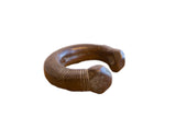 Antique African snake cuff bracelet with an aged patina and finely engraved geometric patterns.