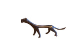 Vintage African cheetah sculpture with a stylized elongated form and dark patina.