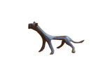 Vintage African cheetah sculpture with a slender, stylized body and dark patina.