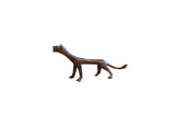 Vintage African cheetah sculpture with an elongated body and dark, weathered patina.