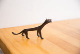 Handmade vintage cheetah sculpture with a dark patina, showing its charming, slender silhouette.