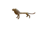 Vintage African lion sculpture in profile with a textured, oxidized metal finish.
