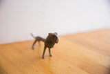 Detailed view of the vintage African lion's sculpted head showing its handmade texture.