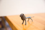Side profile of the vintage lion figure showing its textured mane and dark patina.
