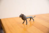 Right side view of the vintage African lion showing its handmade texture and dark patina.