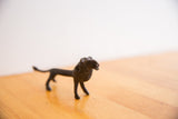 Close view of the handmade African lion's textured surface and dark, aged patina.