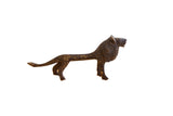 Vintage African lion sculpture with a dark patina and textured handmade details.