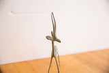 The back of the handmade oxidized gazelle figure, highlighting its tall, slender horns.