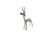 Vintage African left-facing gazelle sculpture with a mottled oxidized finish.