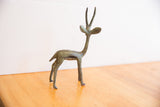 The elegant, slender form of a vintage African gazelle with a time-softened oxidized finish.
