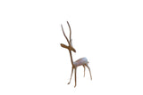 Vintage African gazelle sculpture with a slender form and oxidized handmade metal finish.