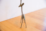 Rear view of the slender, handmade African gazelle, highlighting its oxidized patina.