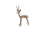 Vintage handmade African gazelle sculpture, time-softened patina, left-facing pose.