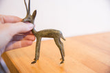 Handmade vintage African gazelle sculpture's textured body, showing its rich patina.