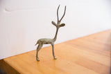 Patinated surface and hind legs of the vintage African gazelle sculpture.