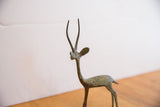 Oxidized patina and handmade texture on the neck and head of the vintage gazelle sculpture.