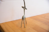 Front view of the vintage African gazelle, highlighting its slender build and long horns.