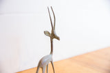 Close-up profile of the vintage gazelle's head, detailing its slender horns and oxidized texture.