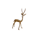 Vintage handmade African gazelle sculpture with a warm, oxidized patina, facing right.