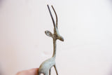 Profile view of the vintage gazelle's head showing the textured, oxidized patina.