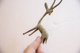 Upward view of the vintage African gazelle highlighting its handmade, oxidized texture.
