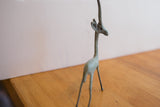 Detail of the handmade African gazelle head with long neck and aged green patina.