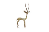 Vintage African gazelle figurine with a brightly oxidized, textured metal finish.