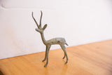 Vintage African gazelle close-up: time-softened bronze tones on stylized horns.