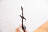 Close-up on the carved details of the vintage gazelle's face, neck and horns.