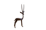 Vintage African right-facing gazelle sculpture with a slender form and dark patina.
