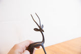 Close-up of the vintage African gazelle's head and slender, textured horns.