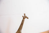 The sculpted head and textured neck detail of the handmade vintage giraffe.