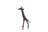 Vintage handmade African giraffe sculpture with a slender body and a dark, textured patina.