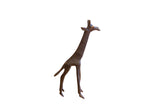 Vintage handmade African giraffe sculpture standing with a dark, textured patina.