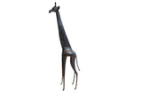 Vintage African giraffe sculpture with a stylized form and dark textured patina.