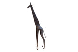 Vintage handmade African giraffe sculpture with a dark patina and stylized form.